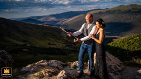 Newlyweds pose for an after wedding photo in Rocky Mountain National Park. The bride and groom stand among natural scenery.